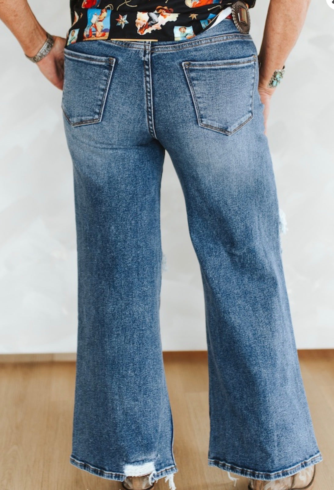 MID WASH DISTRESSED MID RISE WIDE LEG FRAYED BOTTOM JEANS (30IN INSEAM)