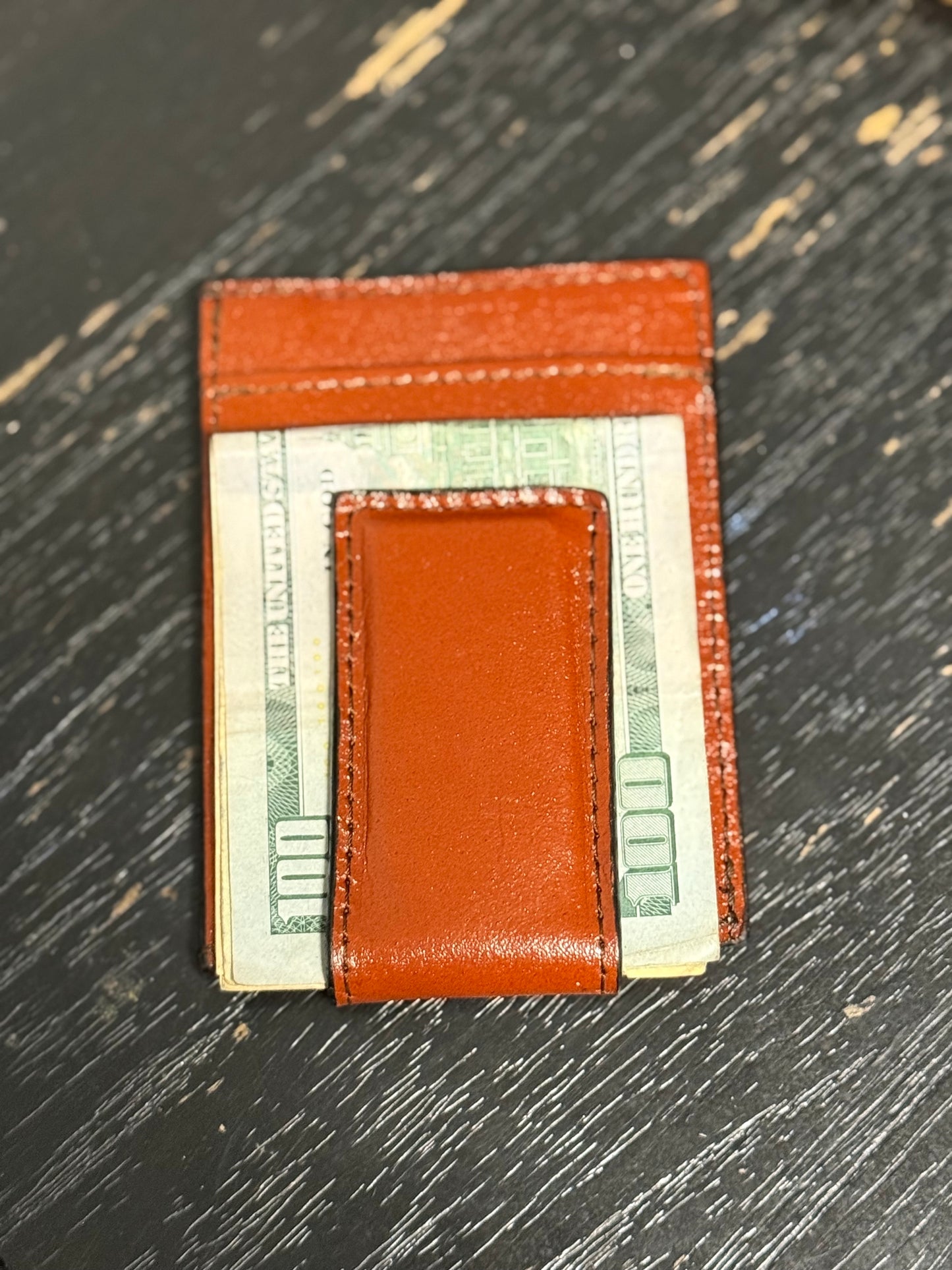 Tooled leather wallet with magnetic money clip