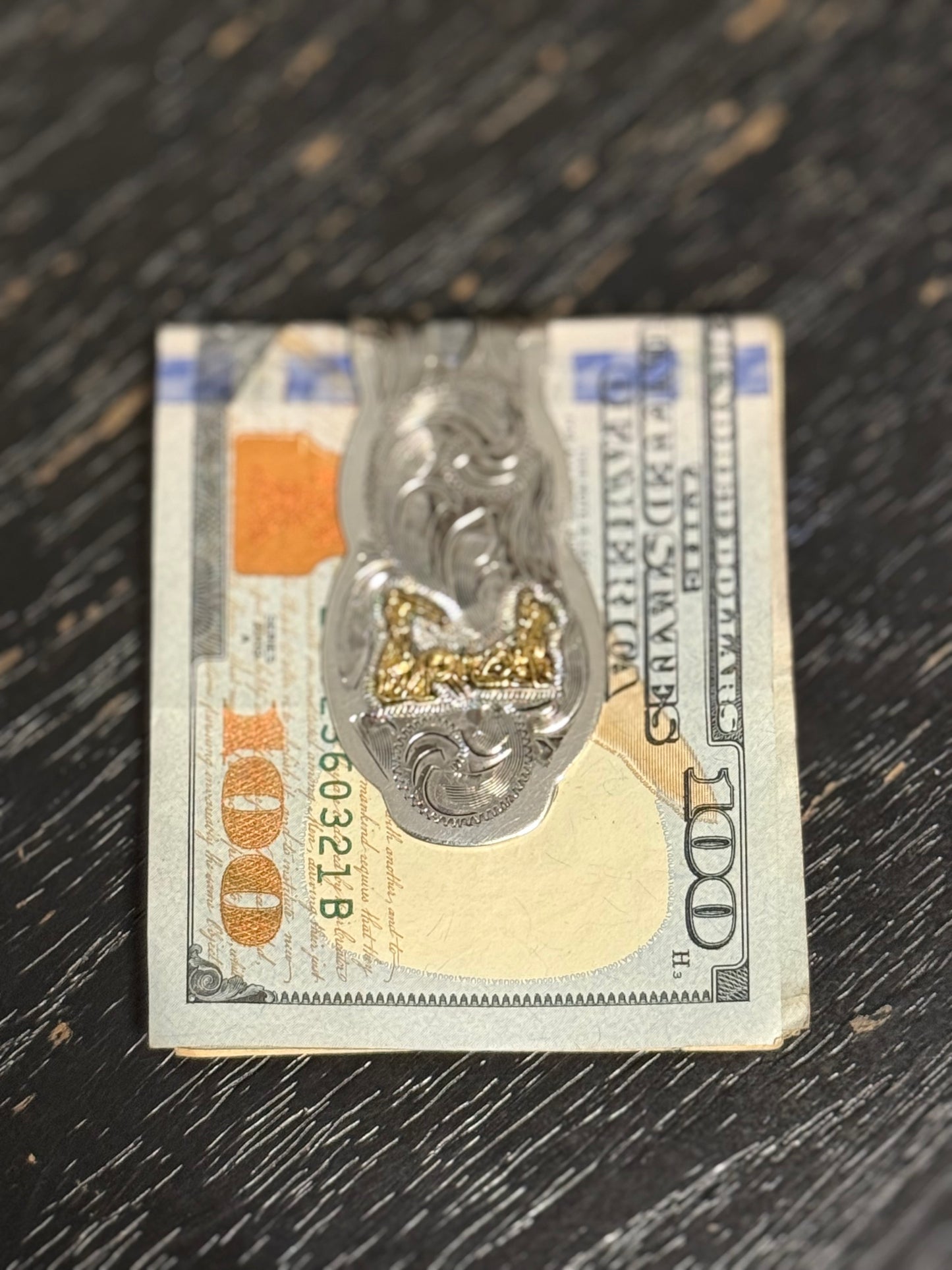 Tooled leather wallet with magnetic money clip