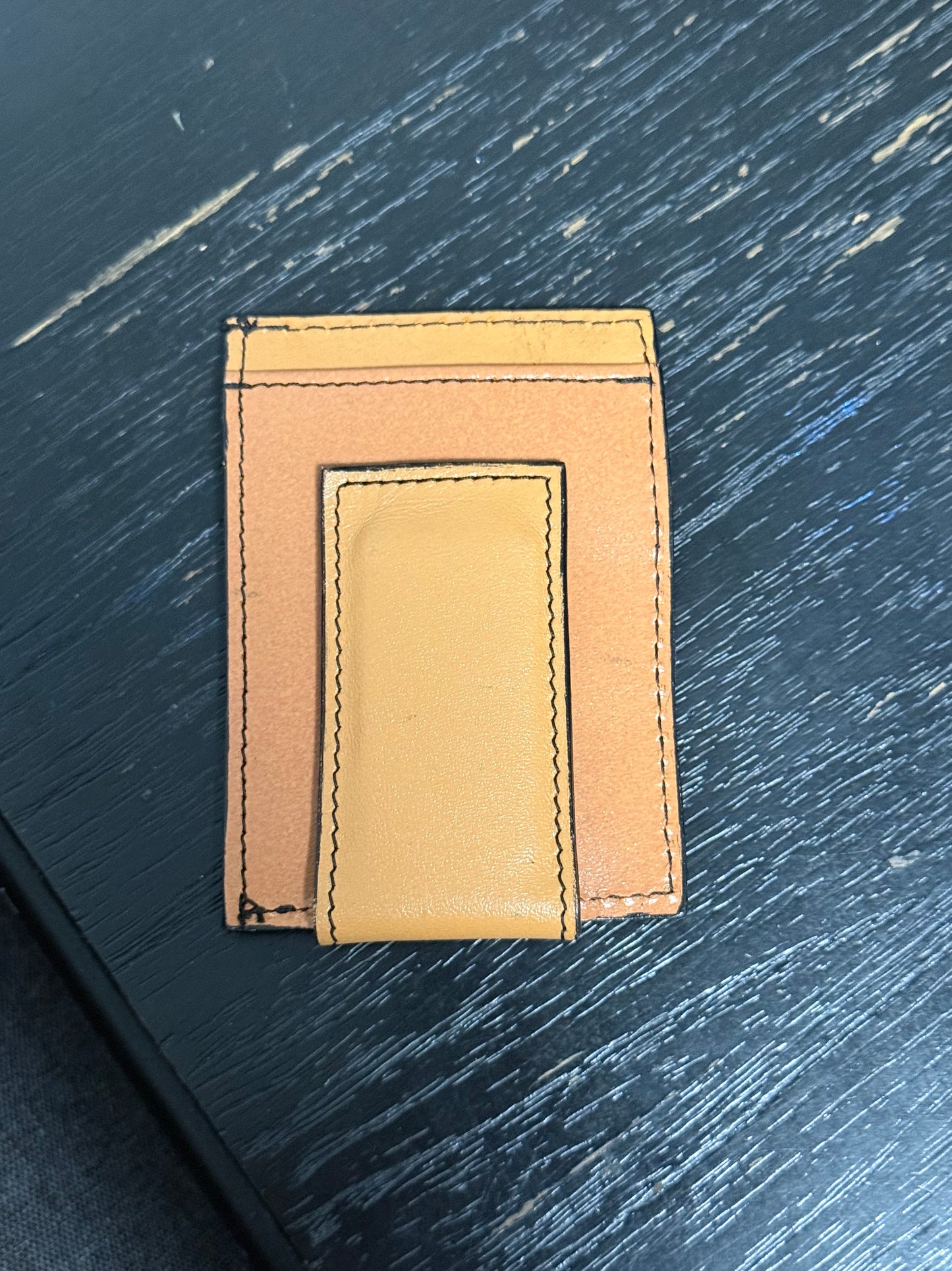 Tooled leather wallet with magnetic money clip