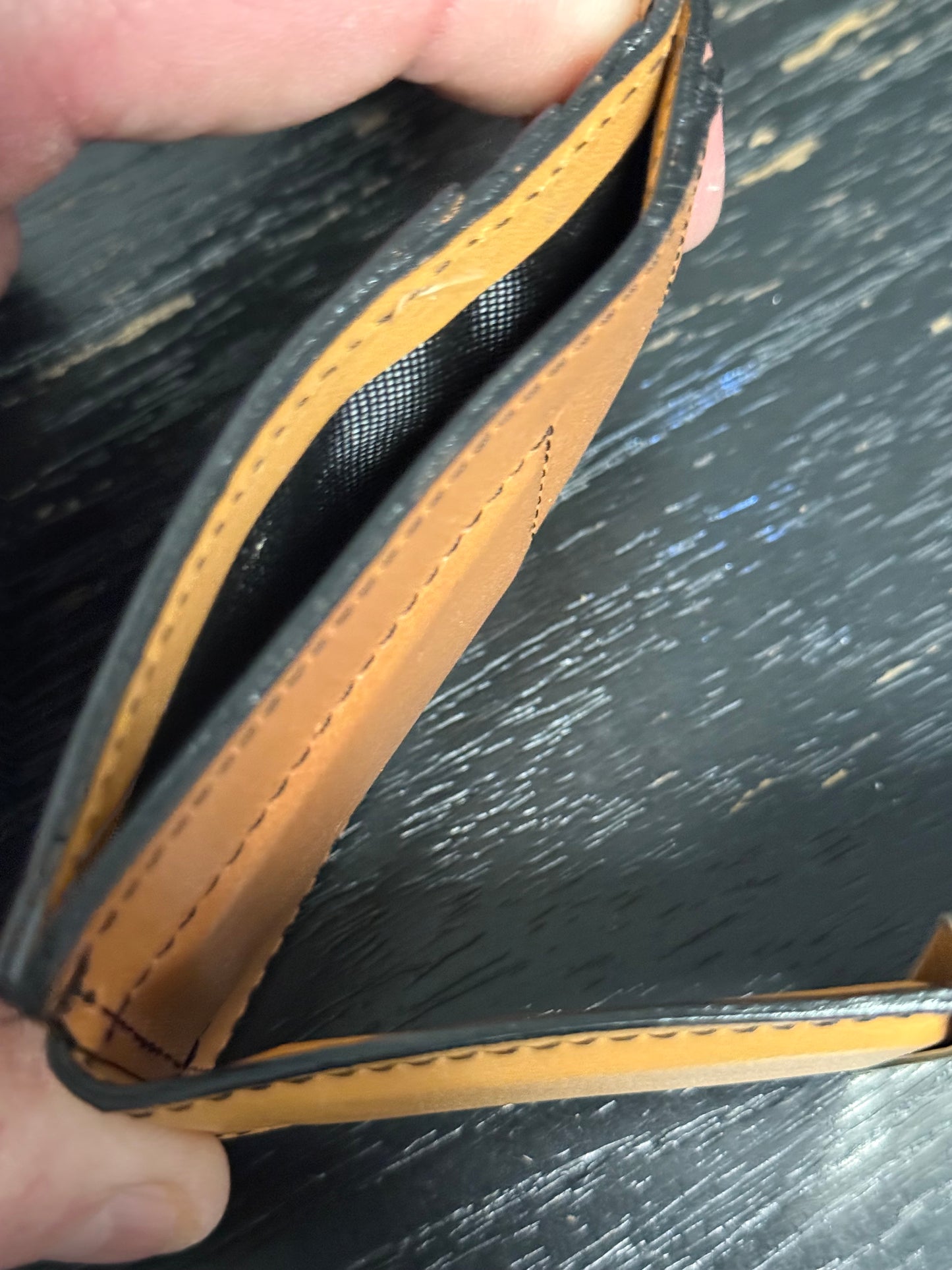 Tooled leather wallet with magnetic money clip