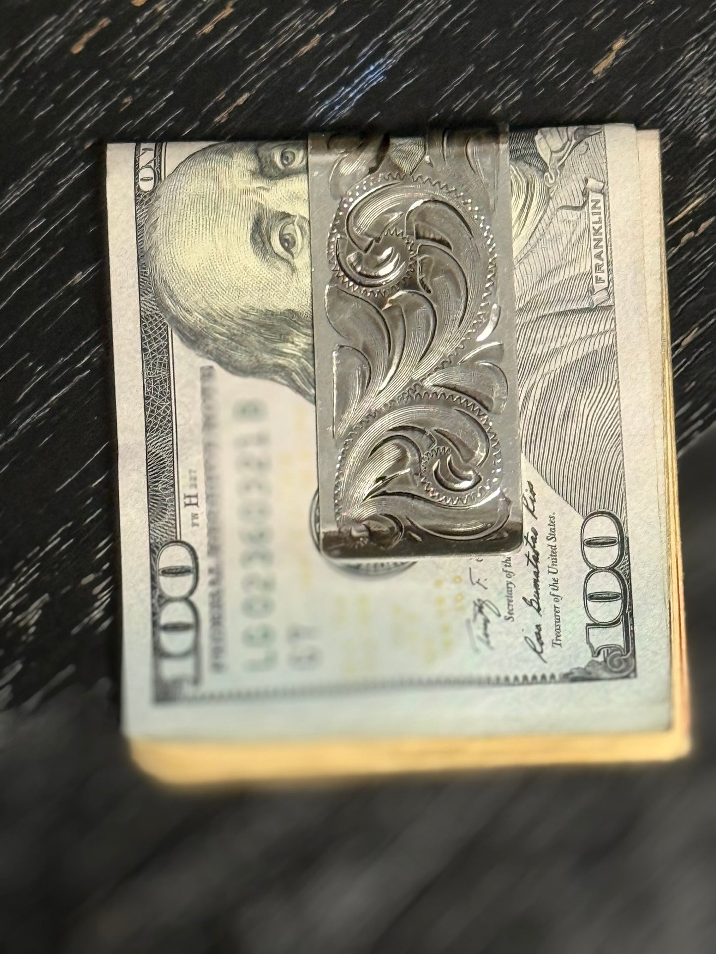 Tooled leather wallet with magnetic money clip