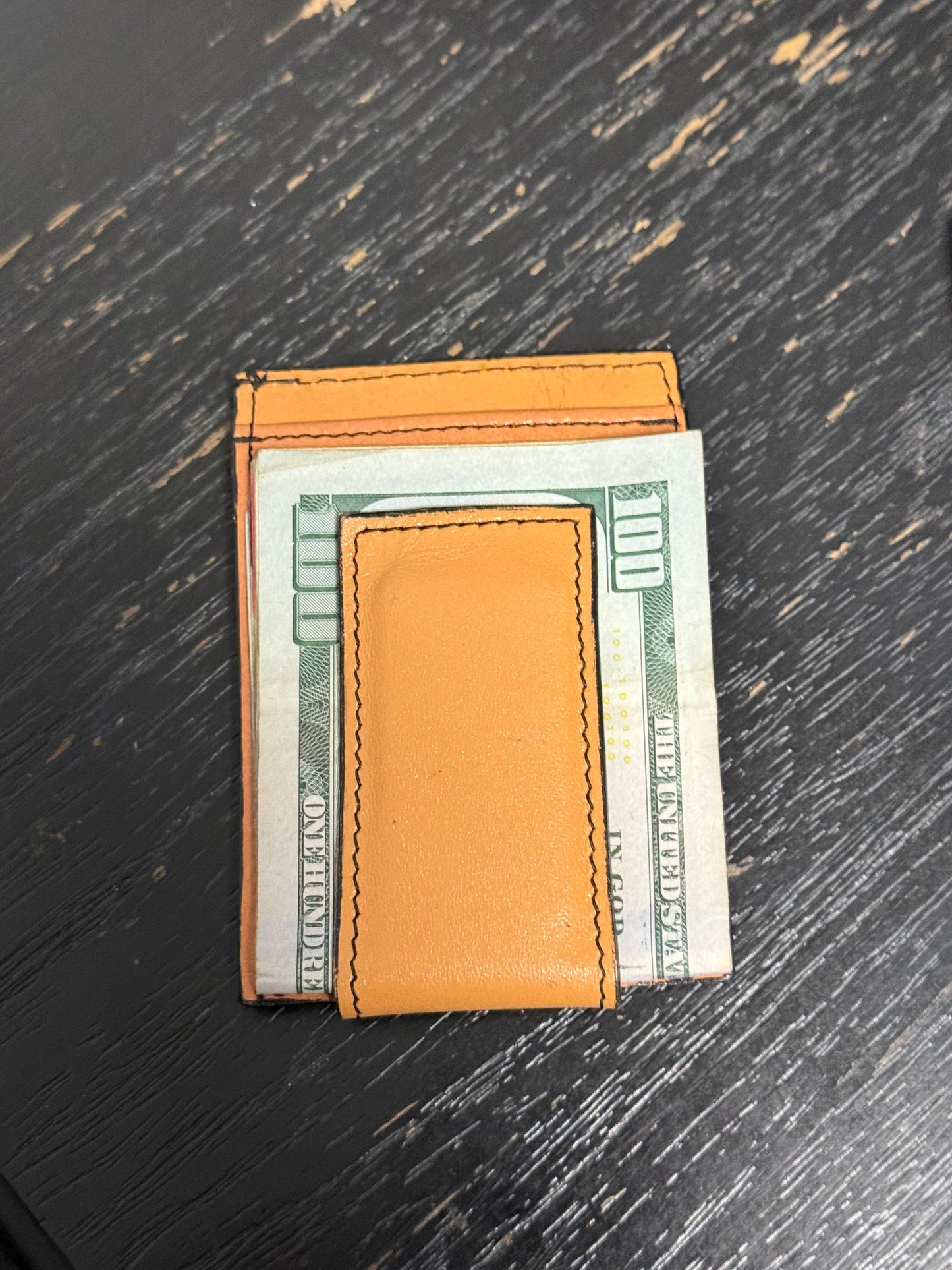 Tooled leather wallet with magnetic money clip